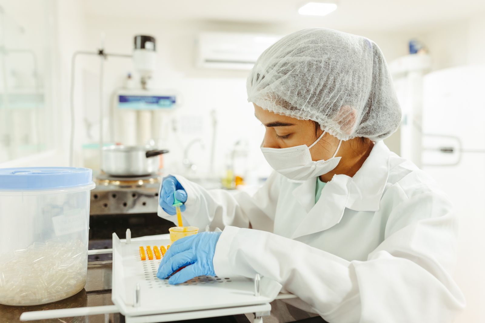 Hero — pharmacist in sterile gowning